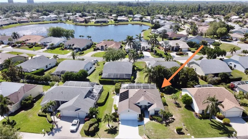 Drone / aerial view featuring a residential view and a water view
