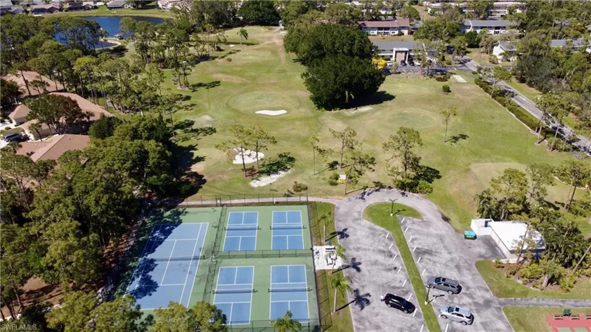 Drone / aerial view featuring a water view and view of golf course