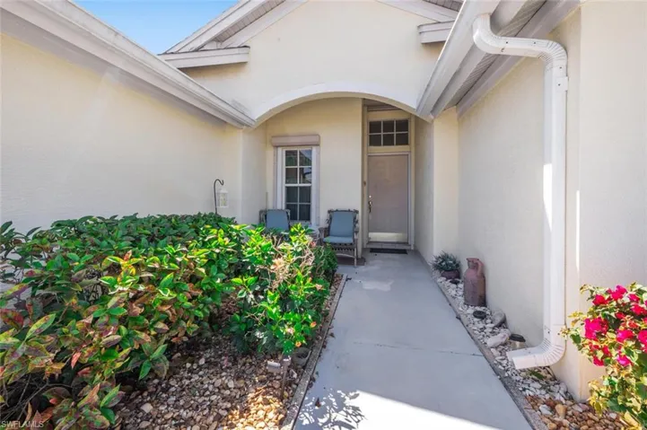 Property entrance with stucco siding