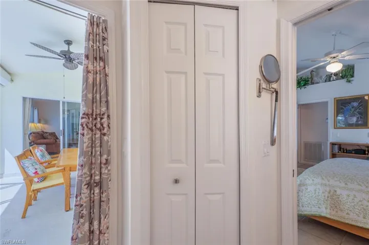 Tiled bedroom with a closet and visible vents