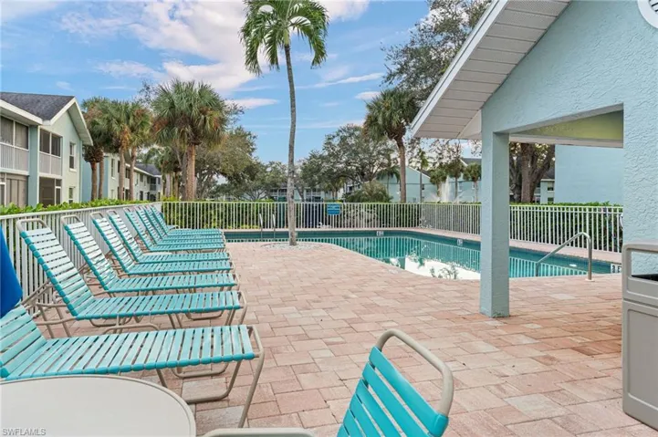 Community pool featuring a patio area
