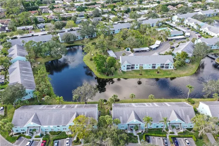 Aerial view of property's location featuring a large body of water