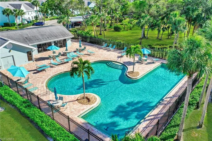 Community pool with a patio area