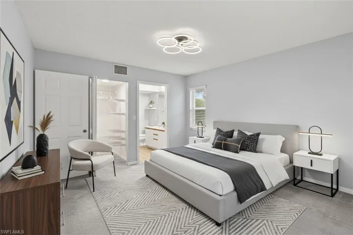 Bedroom virtual staged with ensuite bathroom and light carpet