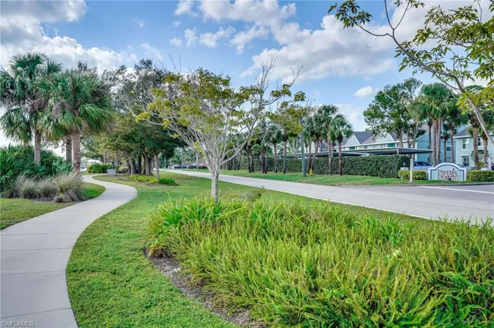 View of property's community featuring a yard