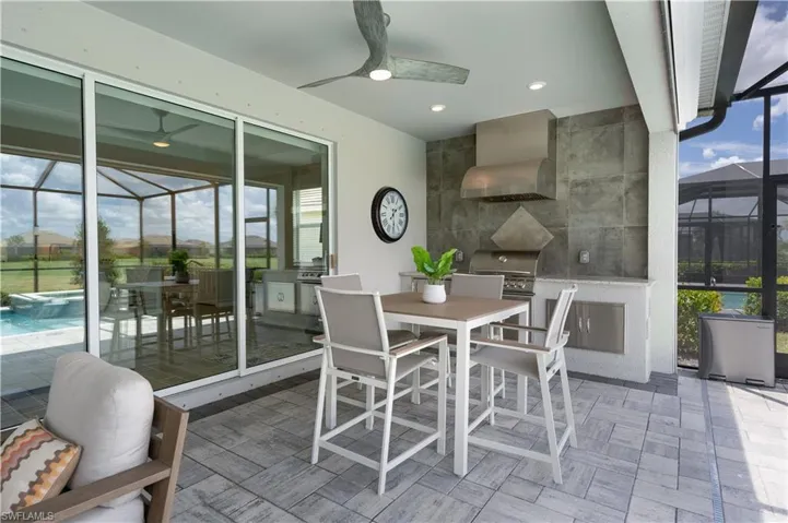 Sunroom with ceiling fan and a wealth of natural light