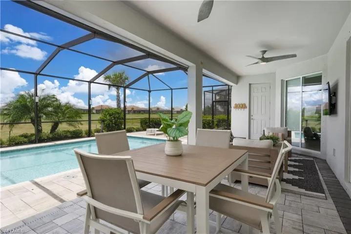 Sunroom / solarium with ceiling fan and a wealth of natural light