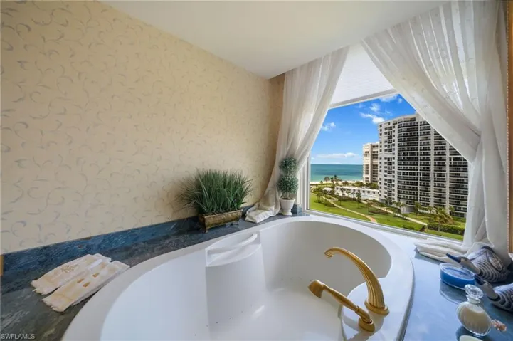 Expansive primary bath with gulf views