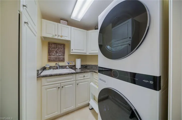 Laundry room with tub