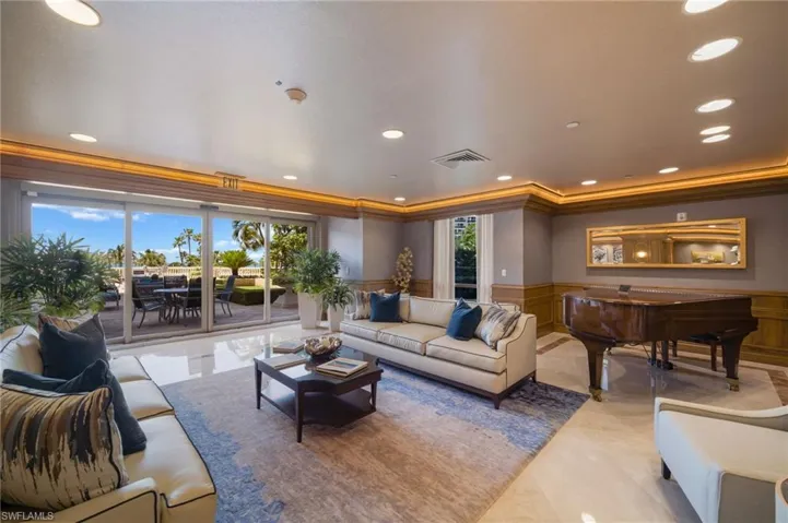 Elegant seating area with piano overlooking the gulf