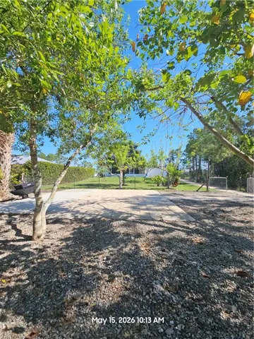 Additional paved area in the back of the property for toys, gadgets, and/or equipment