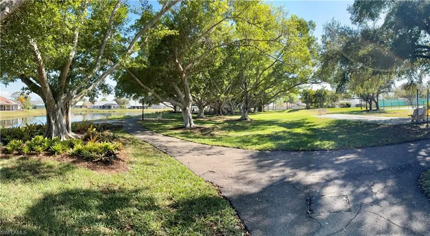 View of property's community park with a water view and a residential view