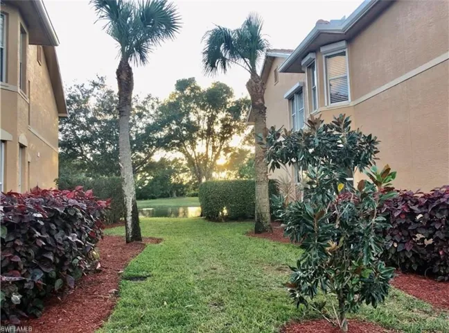 View of green lawn between buildings