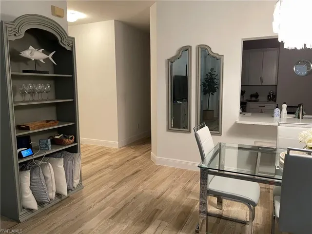 Dining area with light wood-type flooring and baseboards