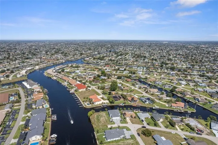 Aerial view with a water view and a residential view