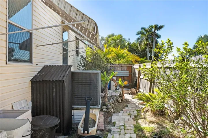View of home's exterior featuring a fenced backyard and a patio
