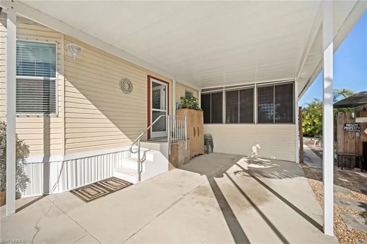 View of patio / terrace featuring a sunroom