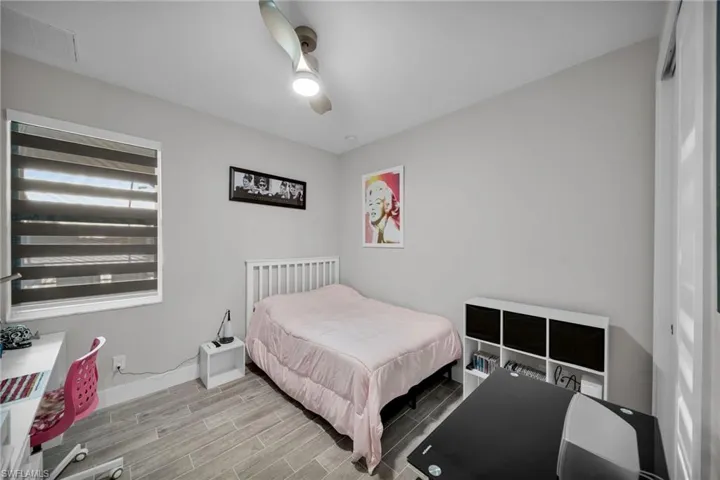 Bedroom featuring ceiling fan and light hardwood / wood-style floors