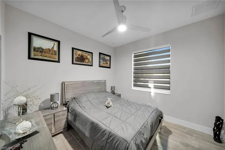 Bedroom featuring light wood-type flooring and ceiling fan