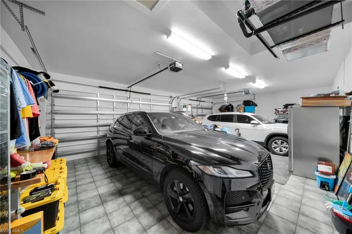 Garage featuring a garage door opener