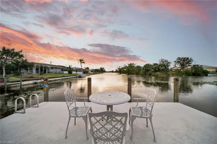 Patio terrace at dusk with a water view
