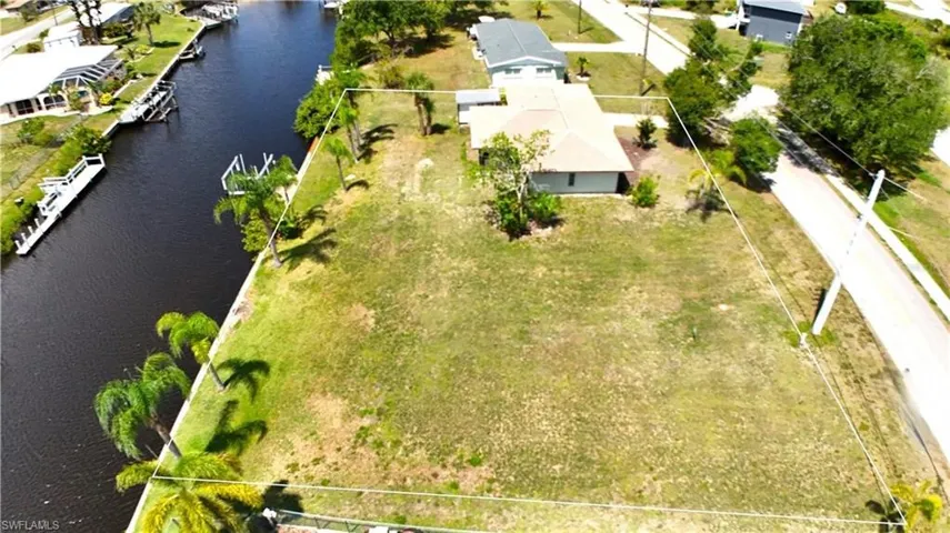 Aerial view of home and extra lot.