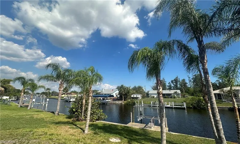 Water view featuring a dock and boat lift