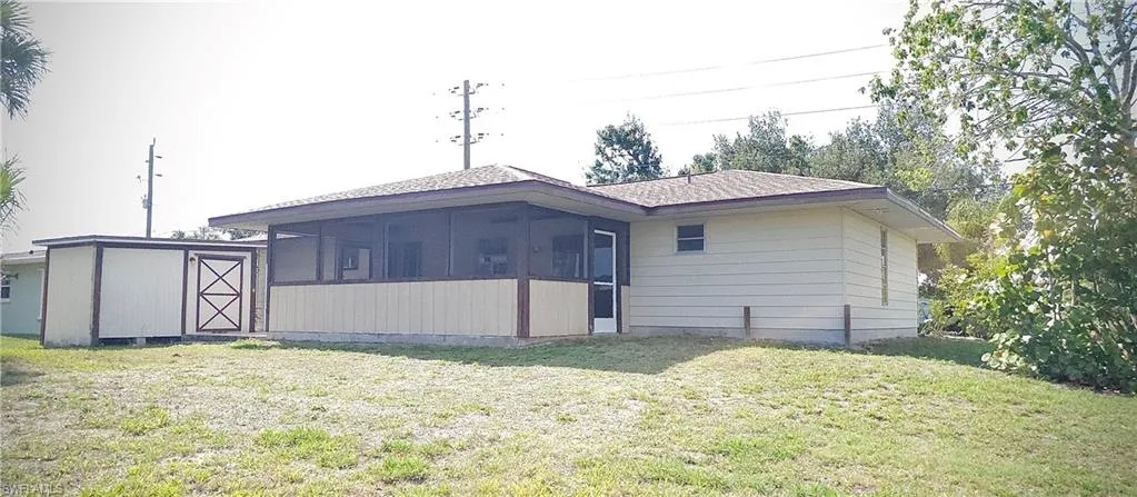 Back view and detached shed.