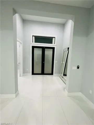 Hall featuring baseboards