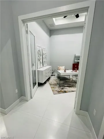 Bathroom featuring light tile patterned floors and vanity