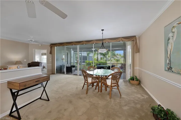 Dining area with crown molding and ceiling fan