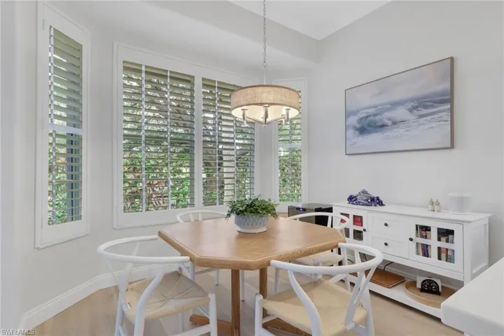 Dining area with light wood-type flooring and baseboards
