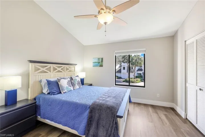 Bedroom with lofted ceiling