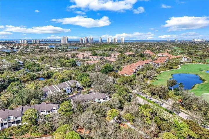 View of property location featuring a nearby body of water and nearby suburban area