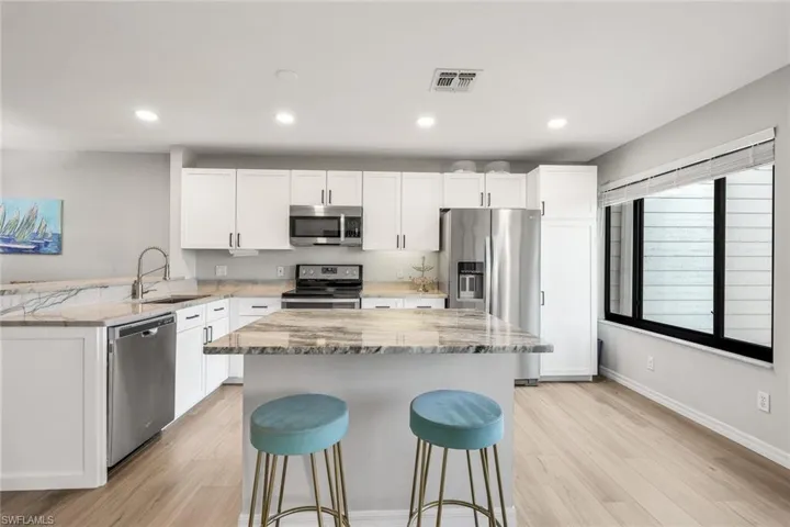 Kitchen has been recently renovated which included removing the wall allowing for the open flow and island added for gathering.