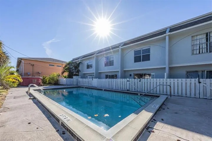 Community pool with a patio area