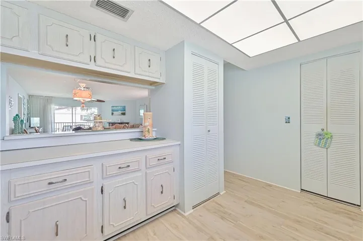 Kitchen with light hardwood / wood-style flooring