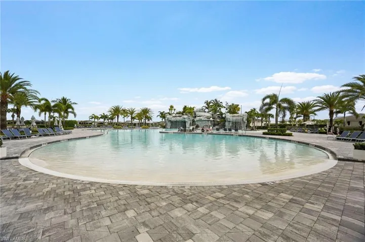 Community pool with a patio