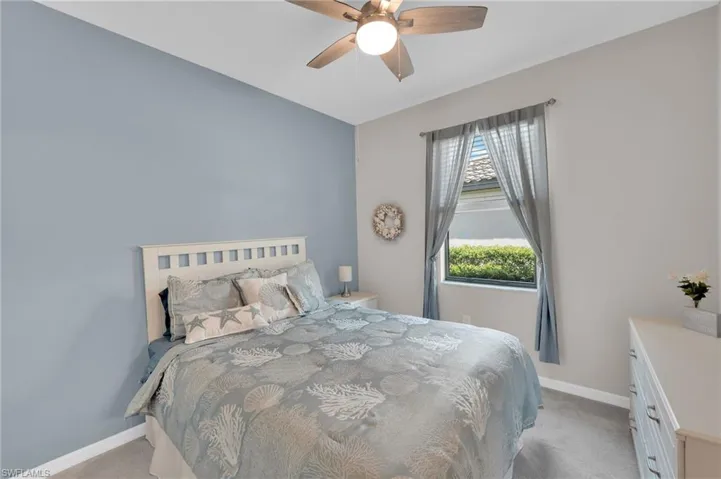 Bedroom featuring carpet floors and ceiling fan