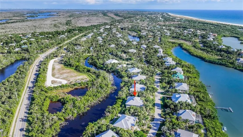 Aerial overview of property's location with a nearby body of water