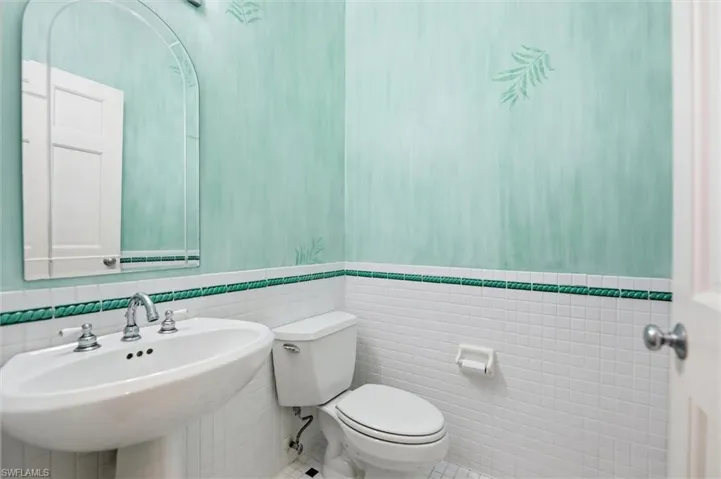 Bathroom featuring tile walls and tile patterned floors