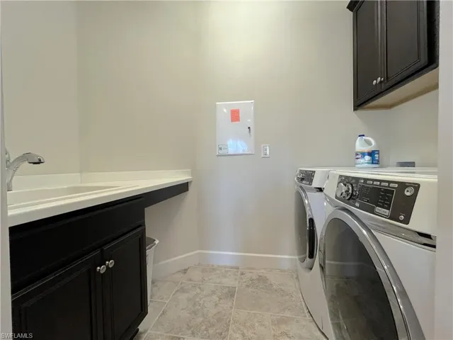 Laundry room with extra storage and sink