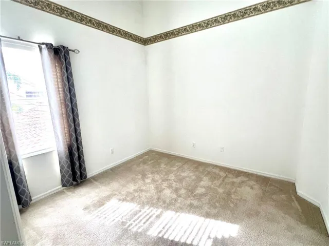 Spare room with carpet flooring
