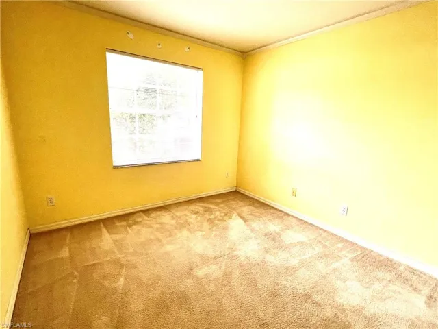Unfurnished room featuring carpet flooring