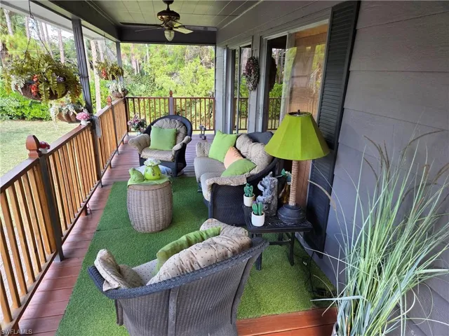 Sunroom with ceiling fan, plenty of natural light, and outdoor lounge area