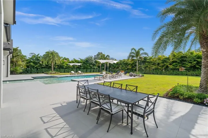 View of patio / terrace featuring an outdoor pool and outdoor dining area