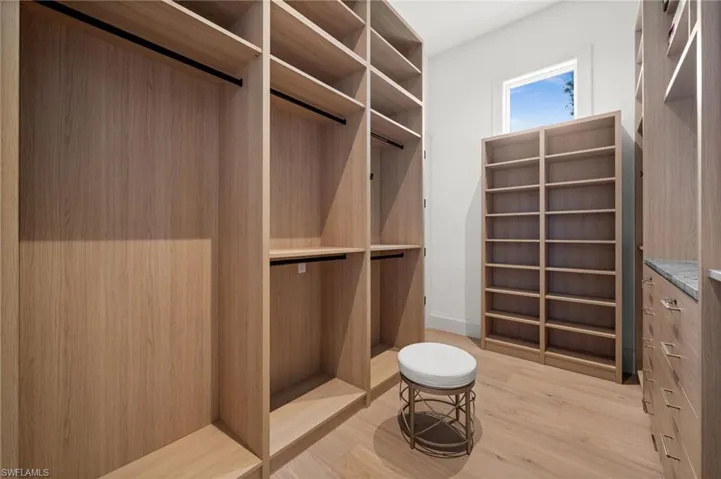 Primary #2 Walk in closet featuring light wood finished floors