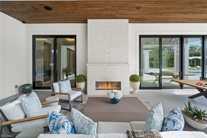 View of patio / terrace featuring an outdoor living space with a fireplace