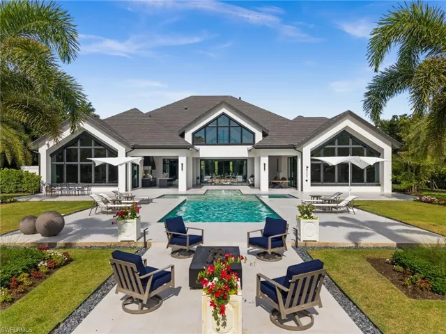 Outdoor pool featuring a patio area, a yard, and outdoor lounge area