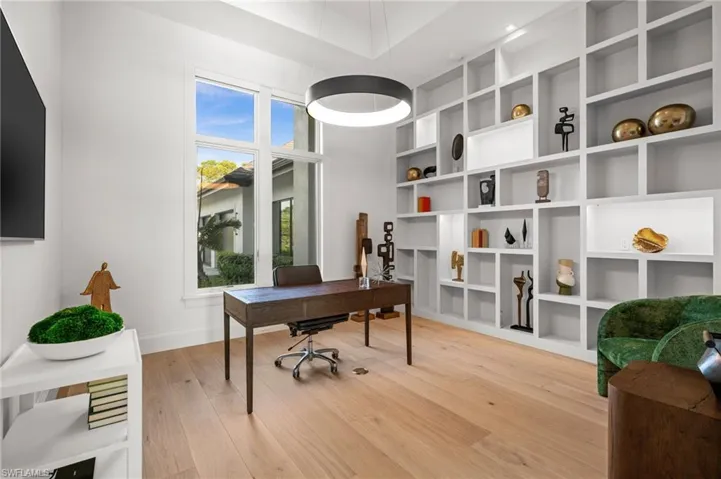 Office space featuring light wood-style floors and baseboards